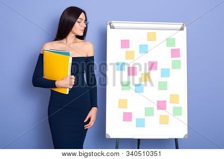 Image Of Attractive Woman Wearing Dress With Bare Shoulders, Holding Yellow Folder With Paprer, Stan