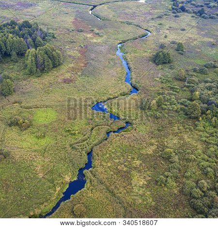 Aerial View Of A Green Fores And River. Texture And Beatiful Background.