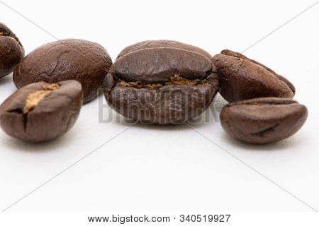 Close Up Of Coffee Beans On A White Background