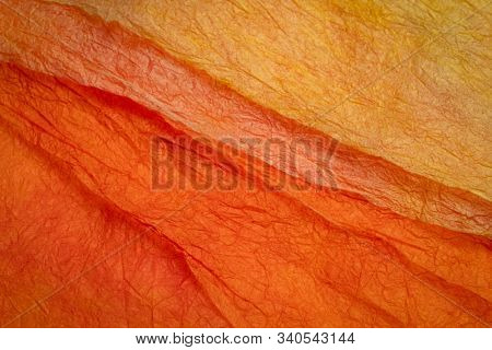 background of orange and red marbled momi paper