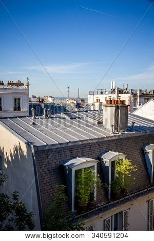 Paris/france - September 6, 2019 : Roof Of A Haussmann Building And Tour Eiffel View From The Montma