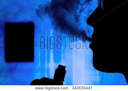 Man With Electronic Cigarette And Smoke Vapping With Neon Lights Background Help Quit Smoking Tobacc