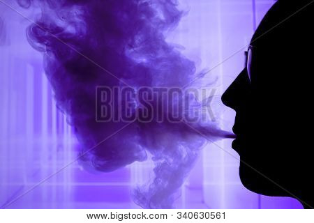 Man With Electronic Cigarette And Smoke Vapping With Neon Lights Background Help Quit Smoking Tobacc