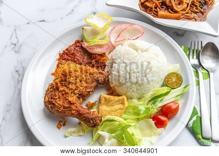 Ayam Penyet Is Indonesian East Javanese Cuisine - Consisting Of Fried Chicken That Is Smashed With T
