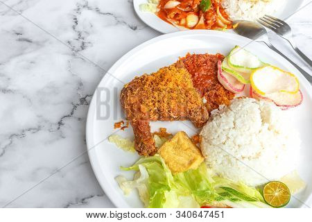 Ayam Penyet Is Indonesian East Javanese Cuisine - Consisting Of Fried Chicken That Is Smashed With T