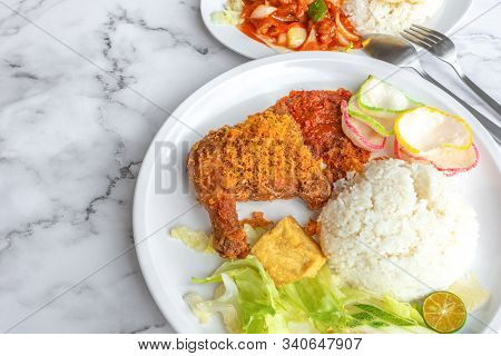Ayam Penyet Is Indonesian East Javanese Cuisine - Consisting Of Fried Chicken That Is Smashed With T
