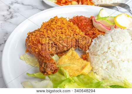 Ayam Penyet Is Indonesian East Javanese Cuisine - Consisting Of Fried Chicken That Is Smashed With T