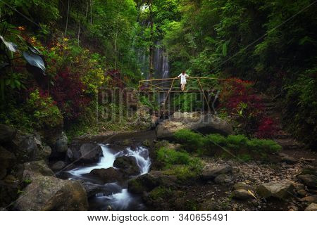 Woman near Labuhan Kebo Waterfall located in Munduk, Bali
