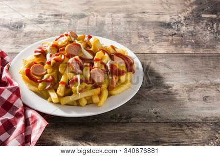 Typical Latin America Salchipapa. Sausages With Fries, Ketchup. Copy Space