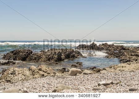Strong Waves, Stones And Sea Cliffs, Sea Point Promenade In Cape Town, South Africa.