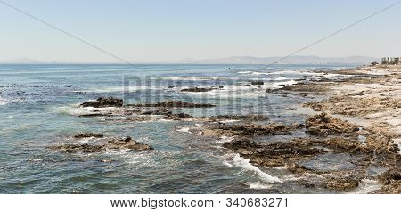 Strong Waves, Stones And Sea Cliffs, Sea Point Promenade In Cape Town, South Africa.