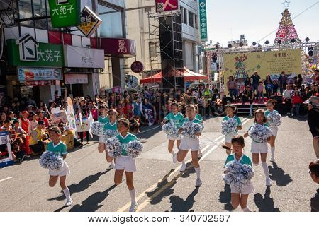 Puli, Taiwan - December 14th, 2019: people parade in Puli carnival at Nantou, Taiwan