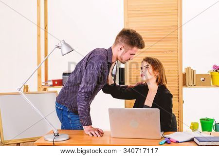 Engaged In Affair. Relations At Workplace. Handsome Man And Sexy Woman Having Romantic Relations At 