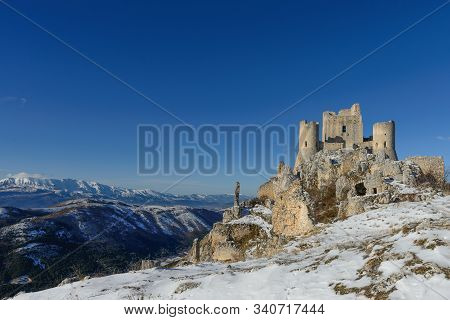 Ancient Fortress In The Abruzzesi Mountains, Snowy Mountain Landscape Of Campo Imperatore - Piana De