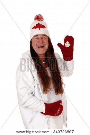 A Happy Indigenous Man Dressed Is White With A Hat And Mittens
With The Canadian Mabel Leaf, Isolate