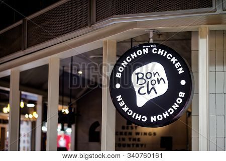 Bangkok, Thailand - December 12, 2019: Close-up Glowing Bonchon Chicken Circular Signboard Ar Mbk Ce