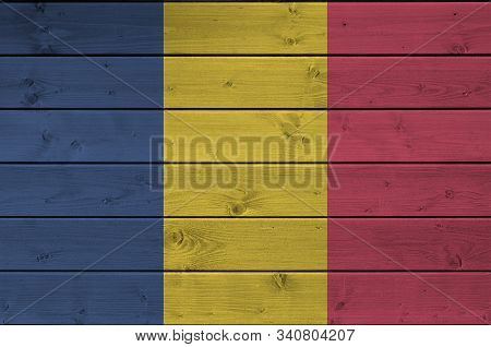 Chad Flag Depicted In Bright Paint Colors On Old Wooden Wall. Textured Banner On Rough Background