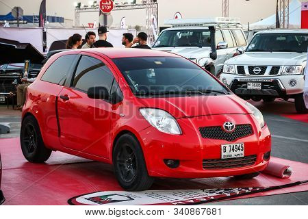 Dubai, Uae - November 15, 2018: Red Hatchback Toyota Yaris Takes Part In The Annual Gulf Car Festiva