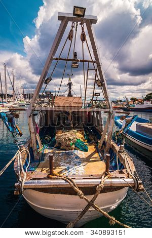 Docked Fishing Boat At The Marina In Sardigna