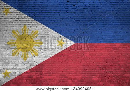 Philippines Flag Depicted In Paint Colors On Old Brick Wall. Textured Banner On Big Brick Wall Mason