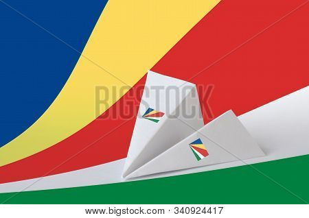 Seychelles Flag Depicted On Paper Origami Airplane. Handmade Arts Concept