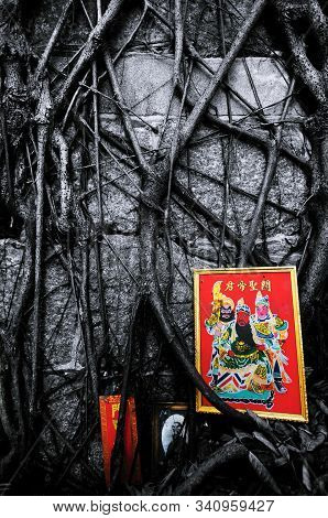 Guan Gong Portrait And Banyan Tree Roots