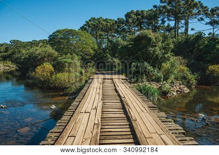 Wooden Bridge Over Creek And Trail Through Forest At The Aparados Da Serra National Park Near Cambar