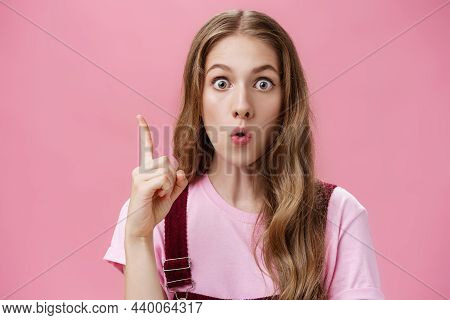 Close-up Shot Of Creative Emotive Young Cute Female Student With Beautiful Natural Wavy Hair Raising