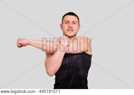 Sport Man Warming Up. Pre Workout Warm Up. Man Doing Excersises Isolated