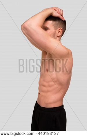 Man Showing Abs. Muscle Man Posing. Strong Body Concept. Topless Sport Man Bodybuilder. Six Pack Spo