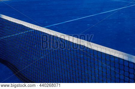 Partial View Of A Blue Paddle Tennis Court
