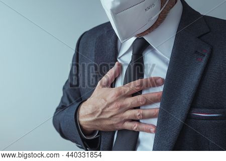 Elegant Businessman With Protective Respiratory Kn95 Mask Having Severe Aching Chest Pain Symptoms, 