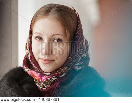 Portrait Of Young Beautiful Woman In Russian Folk Patterned Shawl, Outdoor.
Traditional Headscarf. R