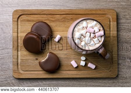 Tasty Choco Pies And Cocoa With Marshmallows On Wooden Table, Top View