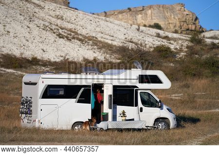 Autotourism. The Caravan Stopped For The Night In The Canyon. In Front Of The Motorhome There Is A T