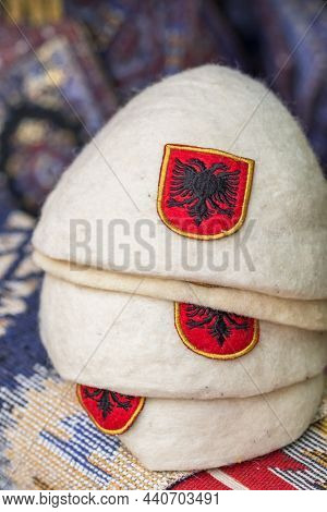 The Plis or Qeleshe, the traditional Albanian woolen hat close-up in souvenir market stall in Albania