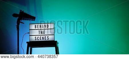 Movie Board Light Box On Studio Stair And Light Snoot Tripod On Colors Gradiant Background.