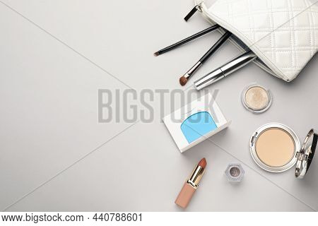 Flat Lay Composition With Facial Oil Blotting Tissues And Makeup Products On Light Grey Background, 