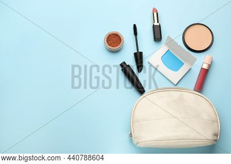 Flat Lay Composition With Facial Oil Blotting Tissues And Makeup Products On Light Blue Background, 
