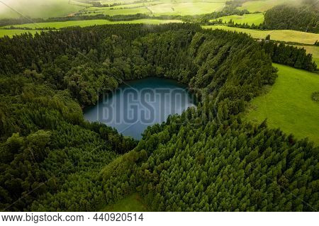 Spectacular Drone View Of Calm Lake Congro Surrounded By Tall Green Trees Located On San Miguel In P
