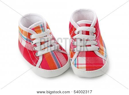 Pink baby girl shoes isolated on white background