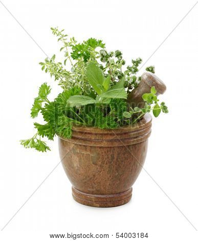 Mortar with herbs isolated on white background
