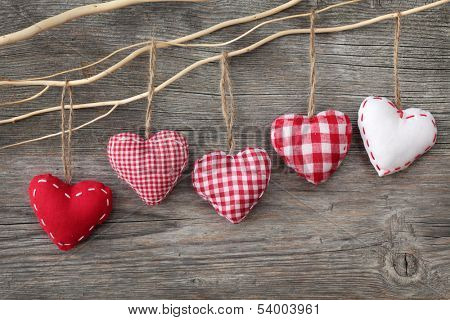 Red hearts on wooden background