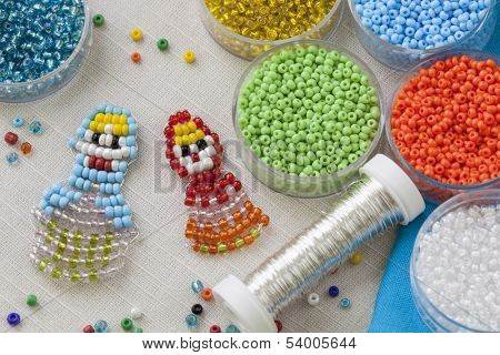 Beaded matreshkas and colorful beads