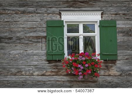 Old wooden window with shutters