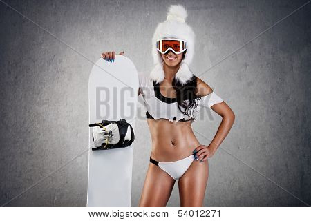 Sexy young female snowboarder