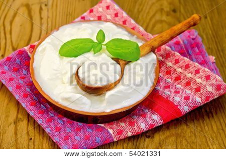 Yogurt In A Clay Bowl With Basil