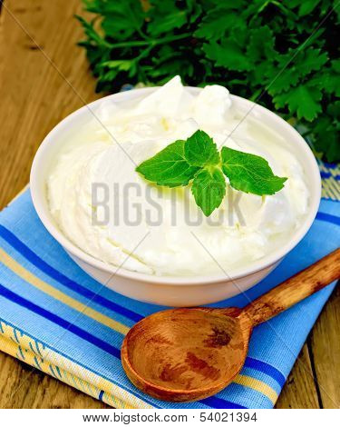 Yogurt In A White Bowl With Mint