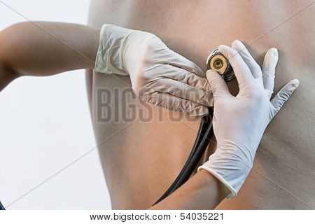 Doctor listening to patient