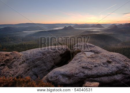 sunrise from foggy Kleiner Winterberg in the national park Saxon Switzerland